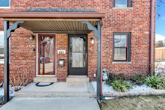 property entrance with brick siding