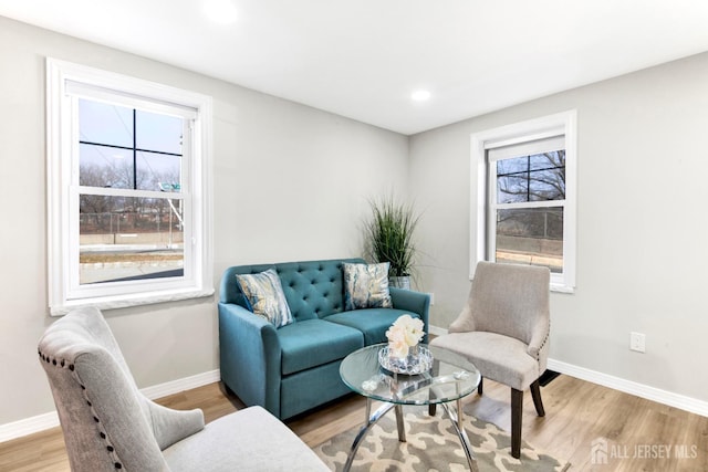 sitting room with recessed lighting, wood finished floors, and baseboards