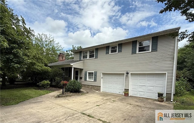 20 Ryan Rd, Cranbury, NJ 08512 - traditional-style home featuring a garage, driveway, and a chimney