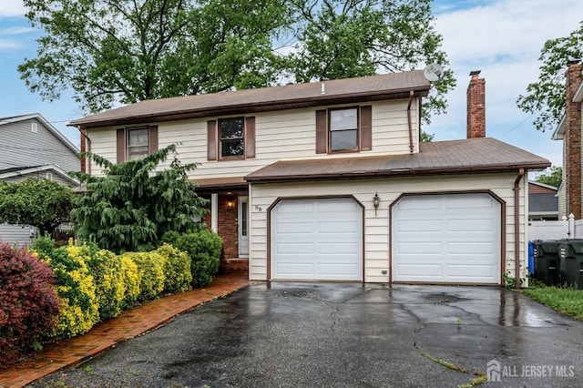98 S Cliff Rd S, Colonia, NJ 07067 - traditional-style home with a garage, driveway, and a chimney