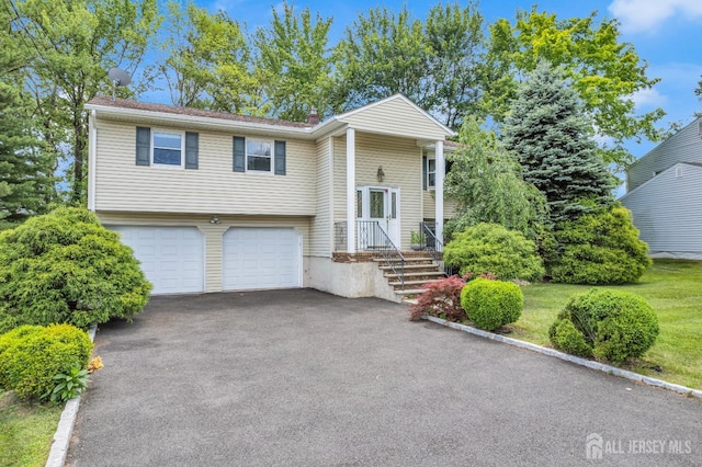 11 Eagle Rd, Edison, NJ 08820 - raised ranch with driveway, a garage, and a chimney