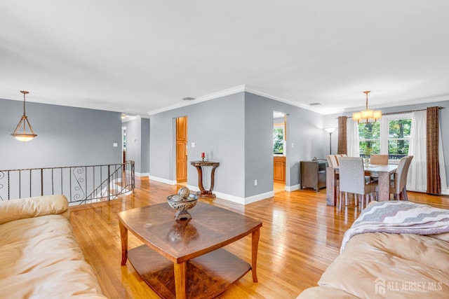 11 Eagle Rd, Edison, NJ 08820 - living area featuring a chandelier, light wood-style floors, and ornamental molding