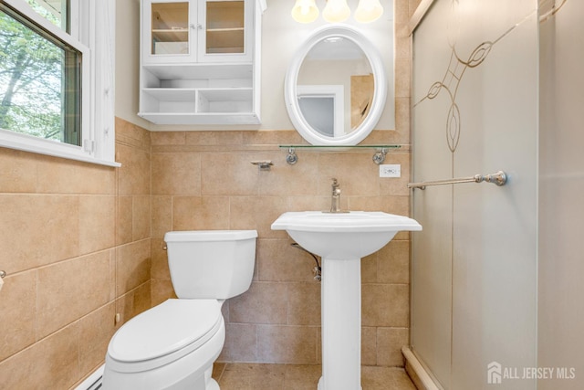 11 Eagle Rd, Edison, NJ 08820 - bathroom with plenty of natural light, tile walls, and a baseboard radiator