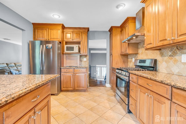 11 Eagle Rd, Edison, NJ 08820 - kitchen with stainless steel appliances, wall chimney range hood, decorative backsplash, light stone countertops, and light tile patterned floors