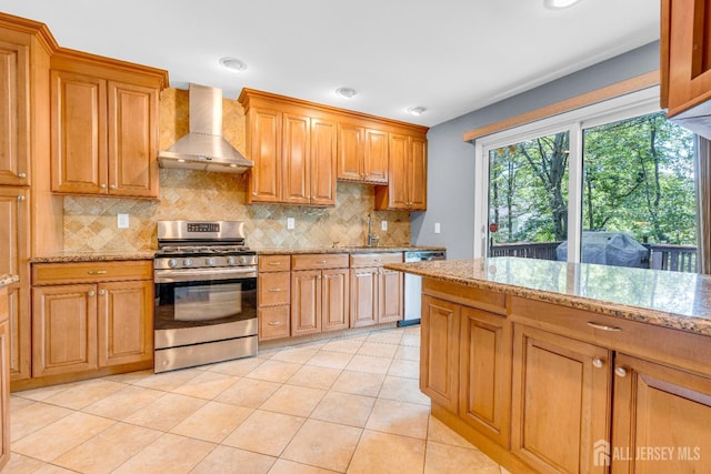 11 Eagle Rd, Edison, NJ 08820 - kitchen featuring appliances with stainless steel finishes, wall chimney range hood, tasteful backsplash, light stone countertops, and recessed lighting