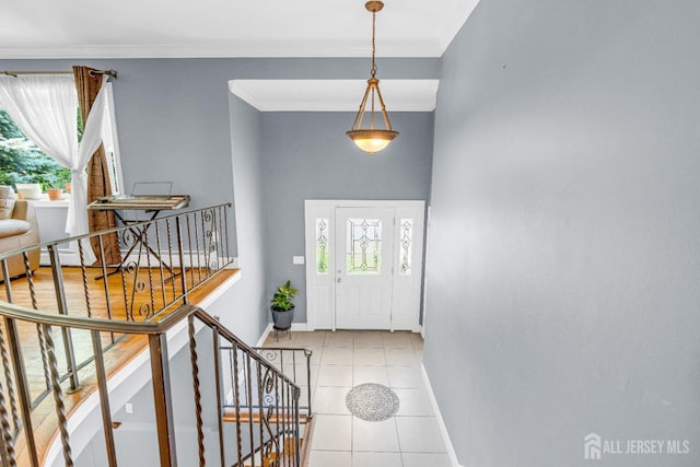 11 Eagle Rd, Edison, NJ 08820 - entrance foyer with light tile patterned floors, crown molding, and stairway