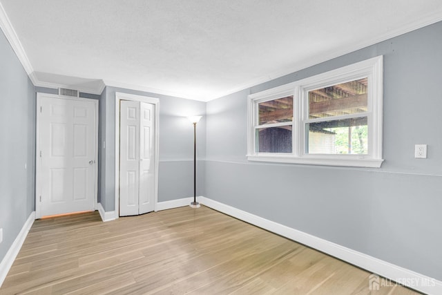 11 Eagle Rd, Edison, NJ 08820 - unfurnished bedroom featuring ornamental molding, light wood-style floors, and a closet