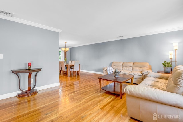 11 Eagle Rd, Edison, NJ 08820 - living area featuring light wood-style floors, crown molding, and a chandelier