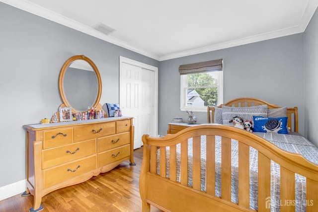 11 Eagle Rd, Edison, NJ 08820 - bedroom featuring light wood-style flooring, a closet, and ornamental molding