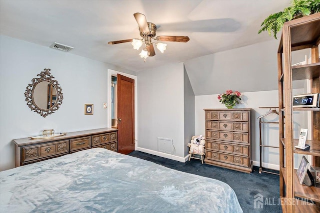 bedroom featuring dark colored carpet and ceiling fan