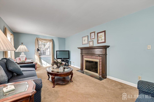 living room featuring a brick fireplace and carpet