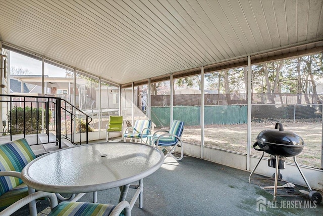 sunroom / solarium with vaulted ceiling