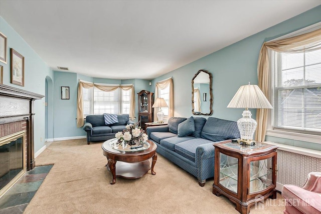 living room featuring a wealth of natural light and light carpet