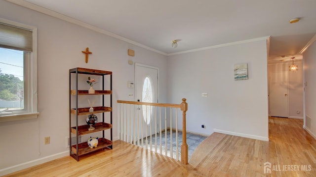 9 Salem Rd, East Brunswick, NJ 08816 - hall featuring healthy amount of natural light, wood finished floors, an upstairs landing, ornamental molding, and baseboards