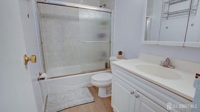 9 Salem Rd, East Brunswick, NJ 08816 - full bath featuring toilet, vanity, wood finished floors, and shower / bath combination with glass door