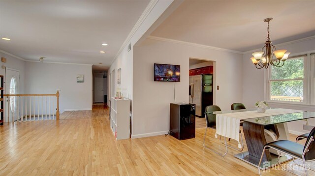 9 Salem Rd, East Brunswick, NJ 08816 - dining area featuring ornamental molding, light wood finished floors, a chandelier, baseboards, and recessed lighting