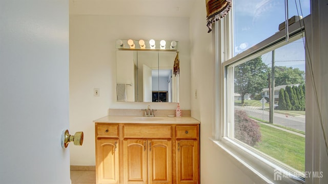 9 Salem Rd, East Brunswick, NJ 08816 - bathroom with plenty of natural light, vanity, baseboards, and tile patterned floors