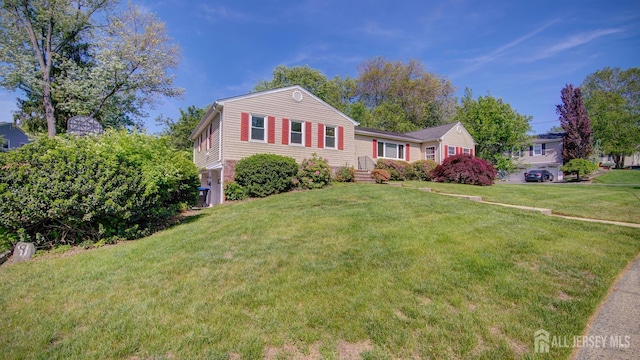 9 Salem Rd, East Brunswick, NJ 08816 - view of front facade with a front yard