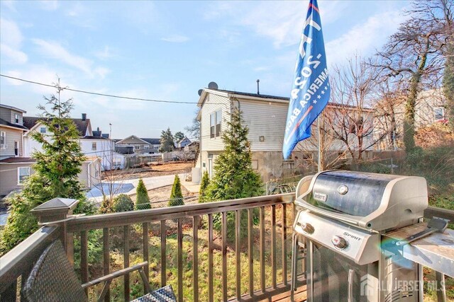 238 Main St, South Amboy, NJ 08879 - wooden terrace featuring area for grilling and a residential view