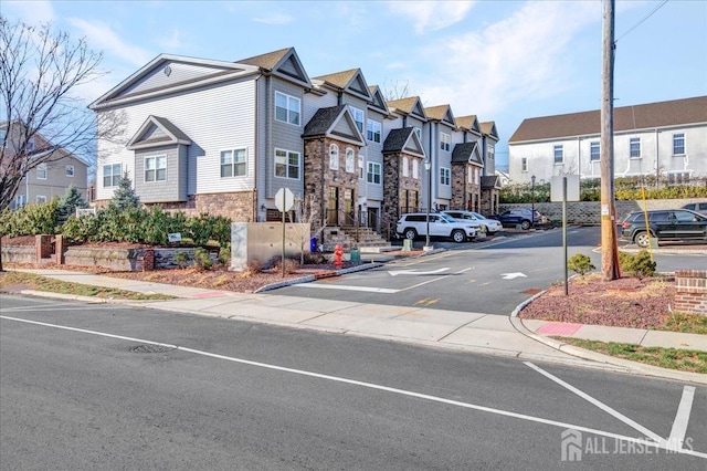 238 Main St, South Amboy, NJ 08879 - view of asphalt street with sidewalks, curbs, a residential view, and traffic signs