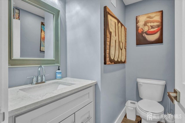 238 Main St, South Amboy, NJ 08879 - half bath featuring toilet, baseboards, and vanity