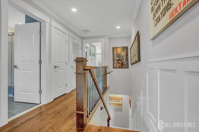 238 Main St, South Amboy, NJ 08879 - hallway featuring an upstairs landing, ornamental molding, wood finished floors, and recessed lighting