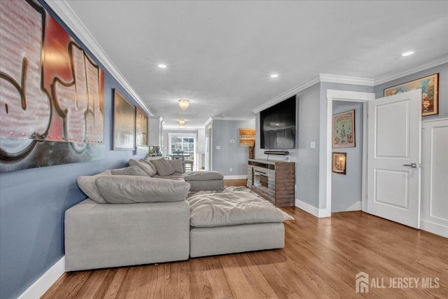 238 Main St, South Amboy, NJ 08879 - living room with crown molding, wood finished floors, baseboards, recessed lighting, and a fireplace