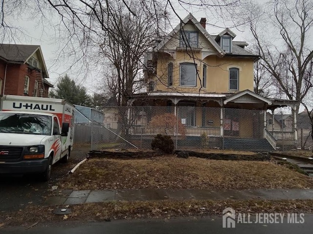 victorian-style house with a porch