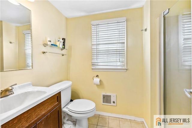 full bathroom featuring healthy amount of natural light, tile patterned flooring, vanity, and toilet