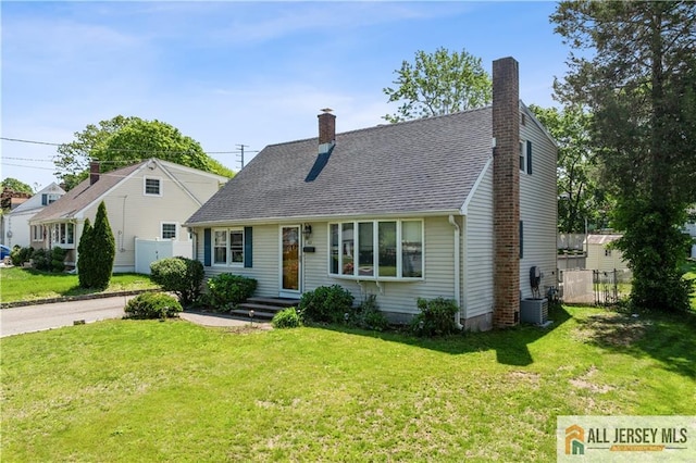 cape cod house with a chimney, central AC, and roof with shingles