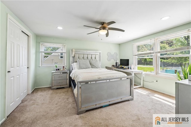bedroom with light colored carpet, baseboards, a desk, recessed lighting, and a ceiling fan