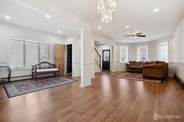 interior space featuring stairs, recessed lighting, baseboards, and wood finished floors