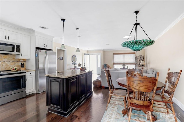 490 Grandin Rd Unit A, Monroe, NJ 08831 - kitchen with ornamental molding, decorative backsplash, pendant lighting, white cabinets, and stainless steel appliances
