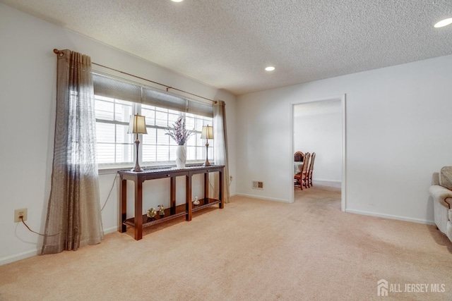 interior space featuring recessed lighting, baseboards, and carpet flooring