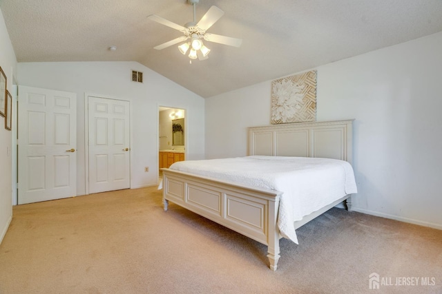 bedroom featuring visible vents, baseboards, light colored carpet, lofted ceiling, and a ceiling fan