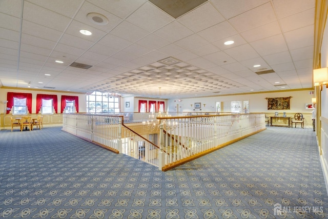 hall featuring an upstairs landing, carpet flooring, recessed lighting, and ornamental molding