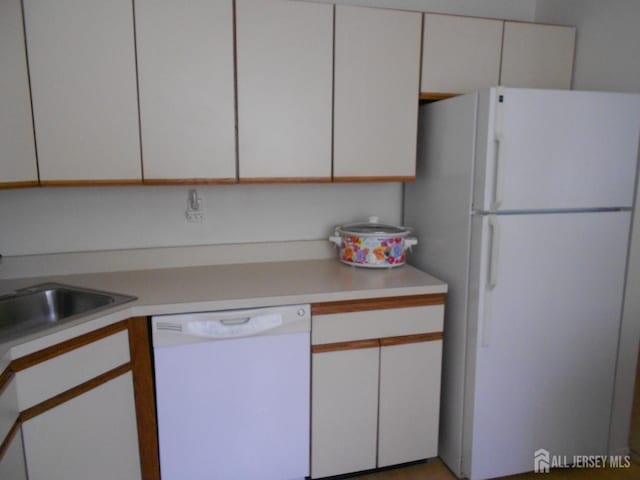 4222 N Bayberry Ct N, South Brunswick, NJ 08852 - kitchen featuring white appliances, light countertops, and white cabinets