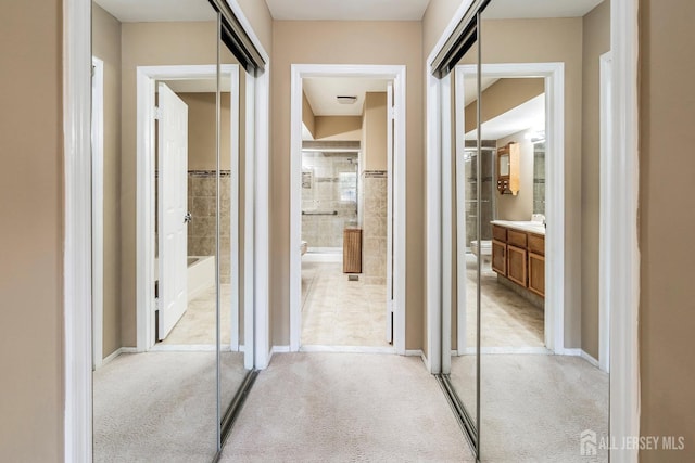 hall with light carpet