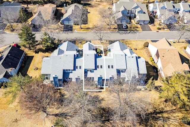 birds eye view of property with a residential view
