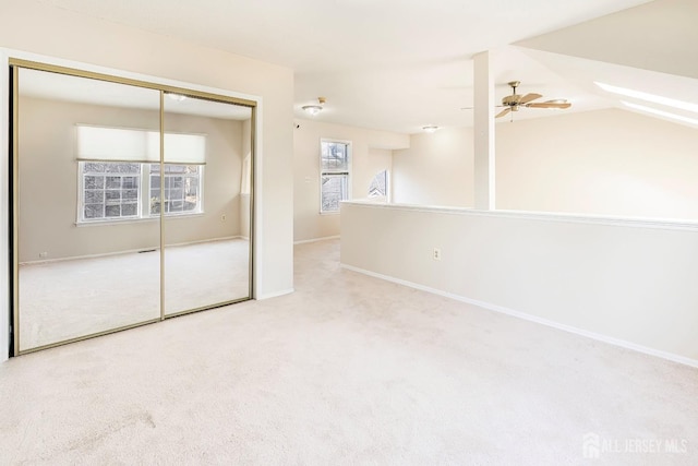 unfurnished bedroom featuring baseboards, carpet flooring, and a closet