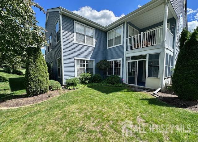 13-B Ashbourne Dr Unit B, Monroe, NJ 08831 - back of house featuring a lawn and a balcony