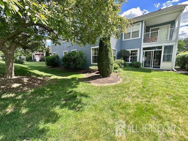 13-B Ashbourne Dr Unit B, Monroe, NJ 08831 - rear view of property with a lawn and a balcony