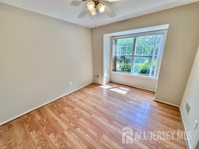 13-B Ashbourne Dr Unit B, Monroe, NJ 08831 - unfurnished room with light wood-style flooring and a ceiling fan