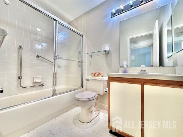13-B Ashbourne Dr Unit B, Monroe, NJ 08831 - full bath with tile patterned flooring, enclosed tub / shower combo, and vanity
