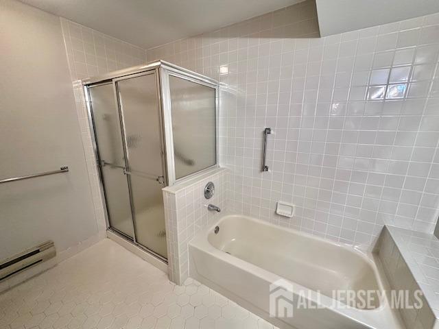 13-B Ashbourne Dr Unit B, Monroe, NJ 08831 - full bathroom with a garden tub, a stall shower, tile patterned floors, and a baseboard heating unit