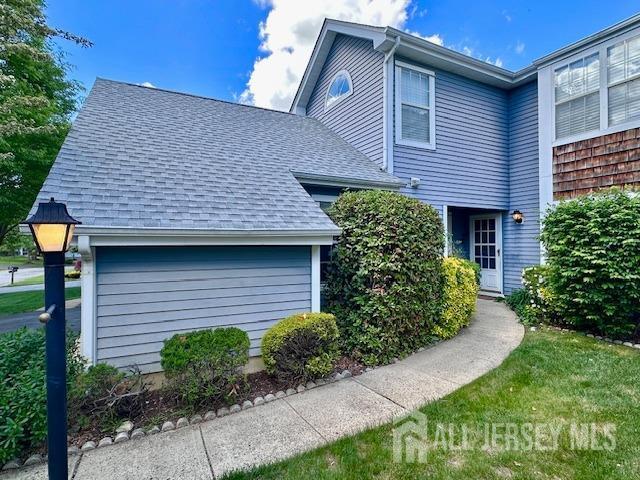 13-B Ashbourne Dr Unit B, Monroe, NJ 08831 - view of side of home with a shingled roof