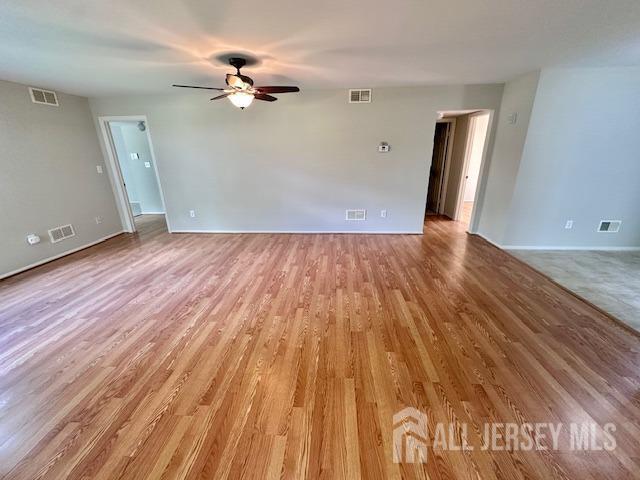 13-B Ashbourne Dr Unit B, Monroe, NJ 08831 - empty room featuring a ceiling fan and light wood-type flooring