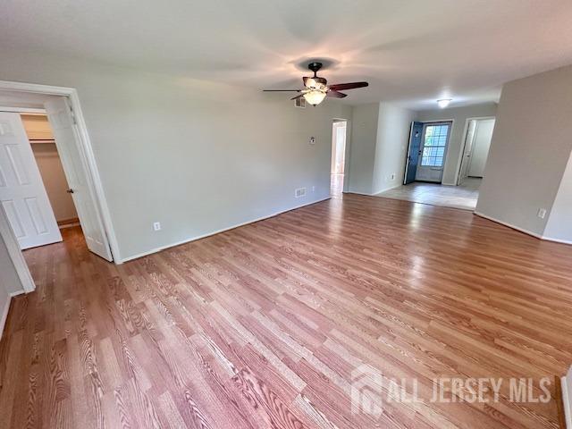 13-B Ashbourne Dr Unit B, Monroe, NJ 08831 - unfurnished living room featuring ceiling fan and light wood finished floors