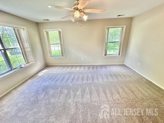 13-B Ashbourne Dr Unit B, Monroe, NJ 08831 - spare room featuring healthy amount of natural light, carpet, and ceiling fan