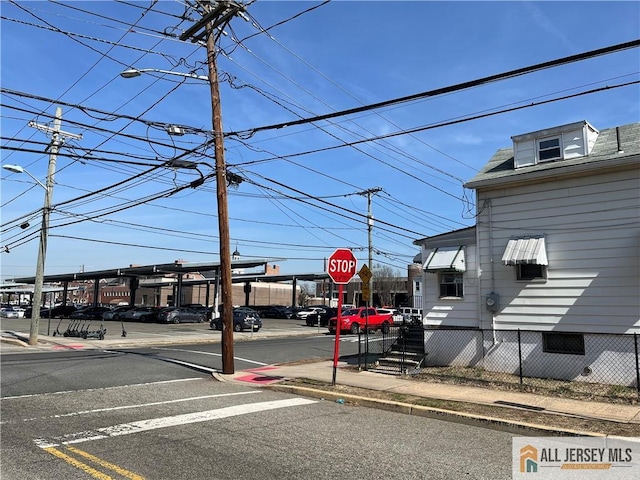 34 Bartlett St, New Brunswick, NJ 08901 - view of asphalt street featuring sidewalks, street lighting, traffic signs, and curbs